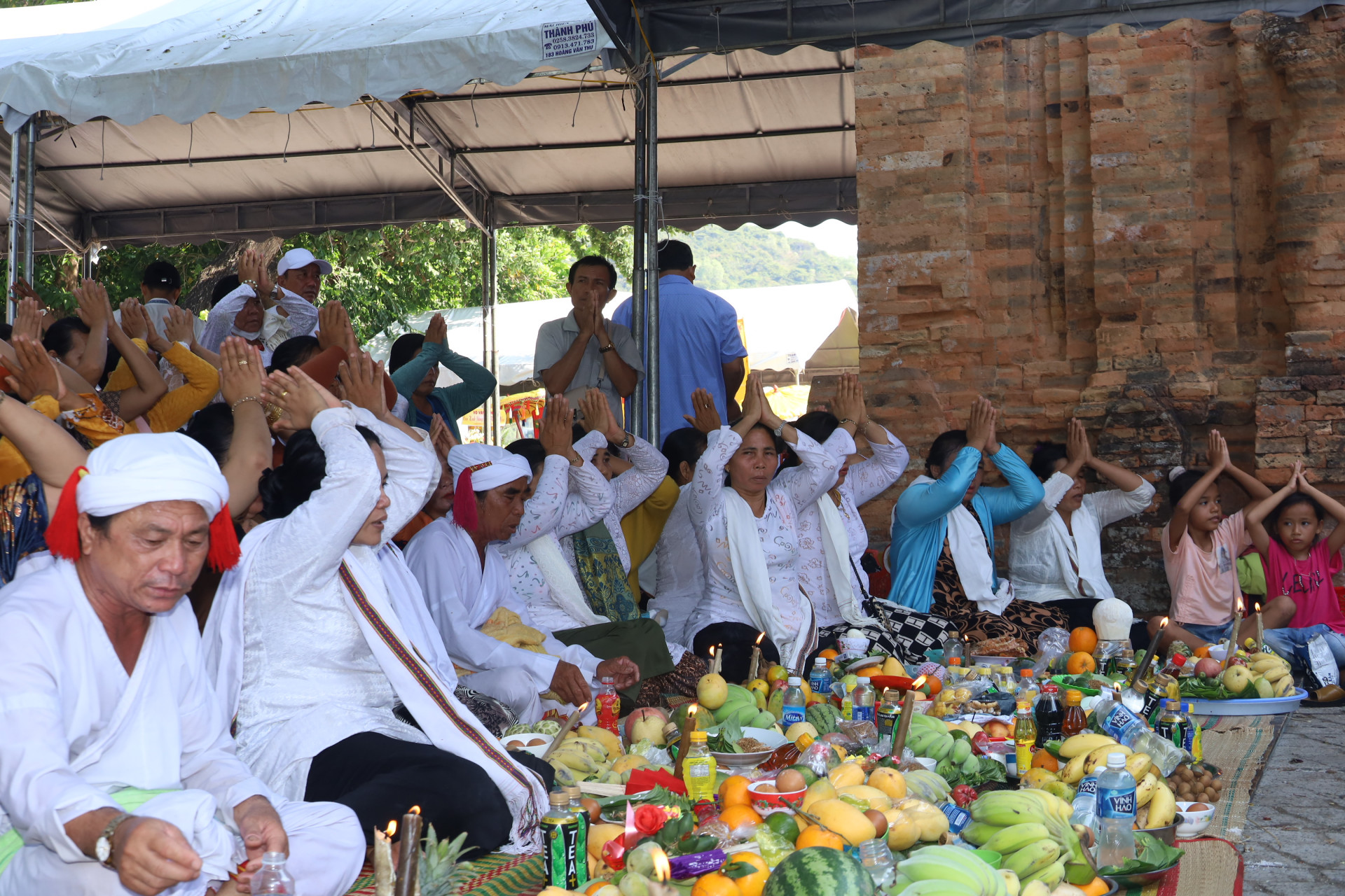 Cham people performing ritual acts to worship Goddess Ponagar at Ponagar Temple Festival

