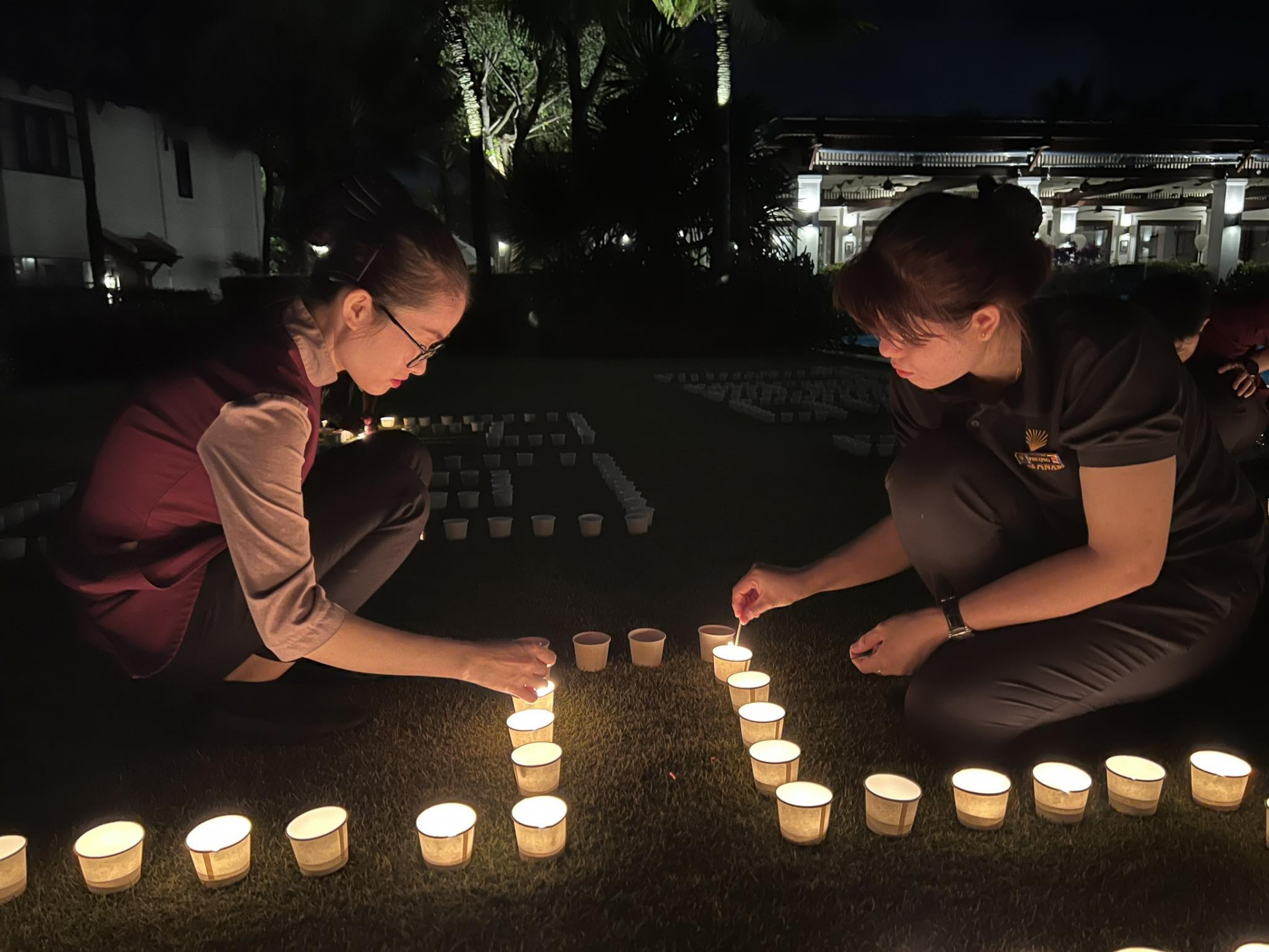 The Anam Cam Ranh staff lighting candles