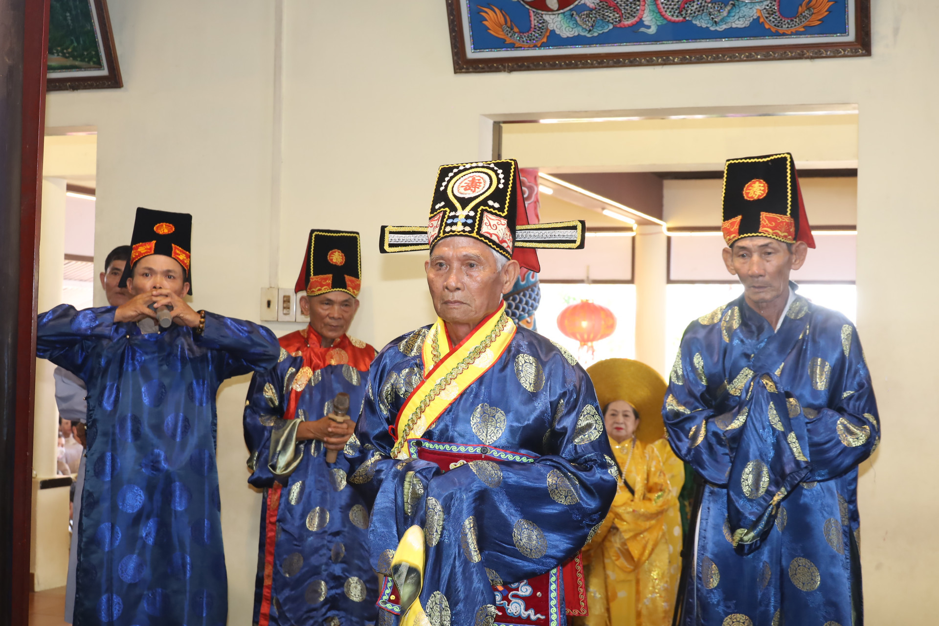Elders of Dien Dien Commune performing traditional ritual acts

