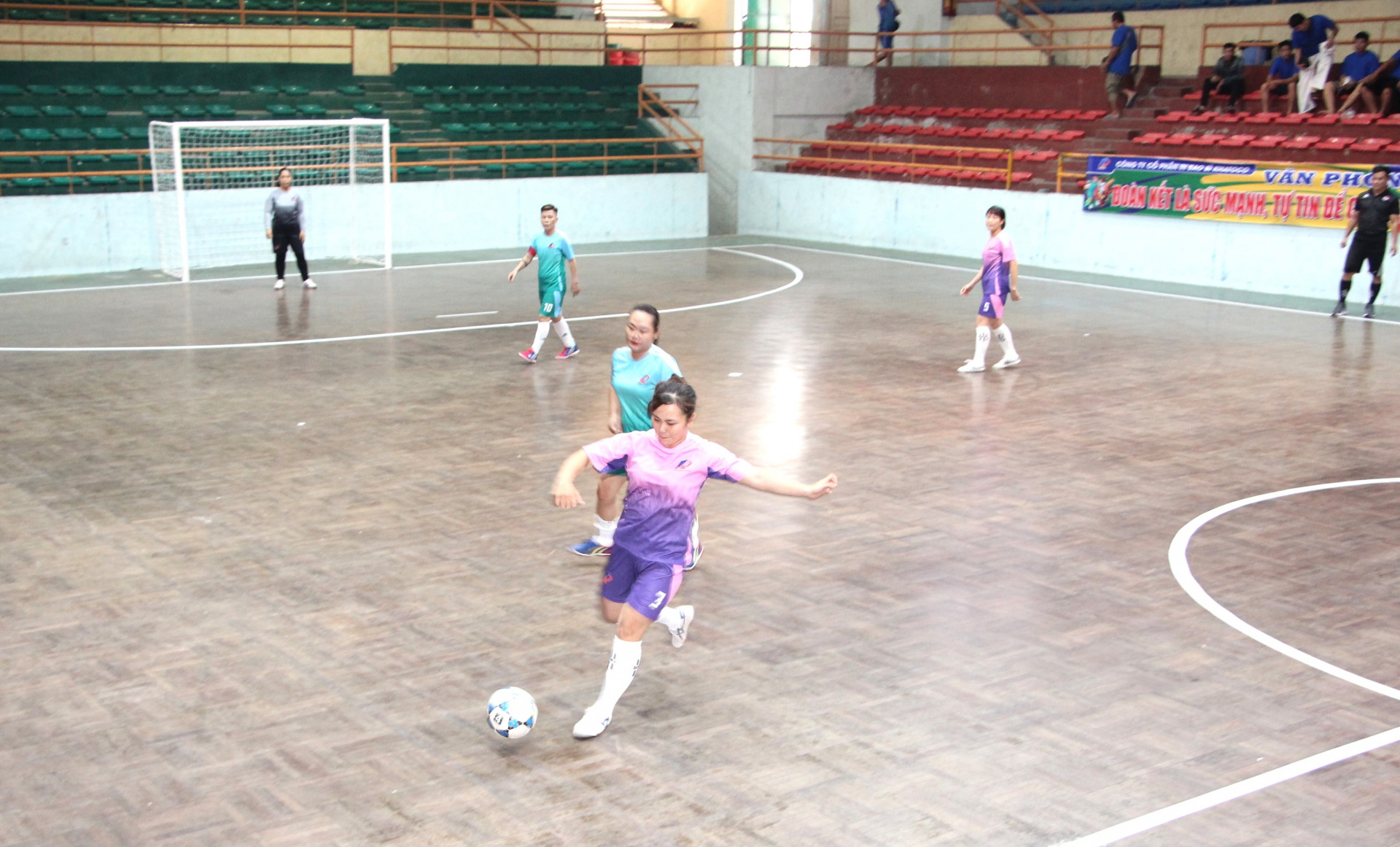 Female players playing football

