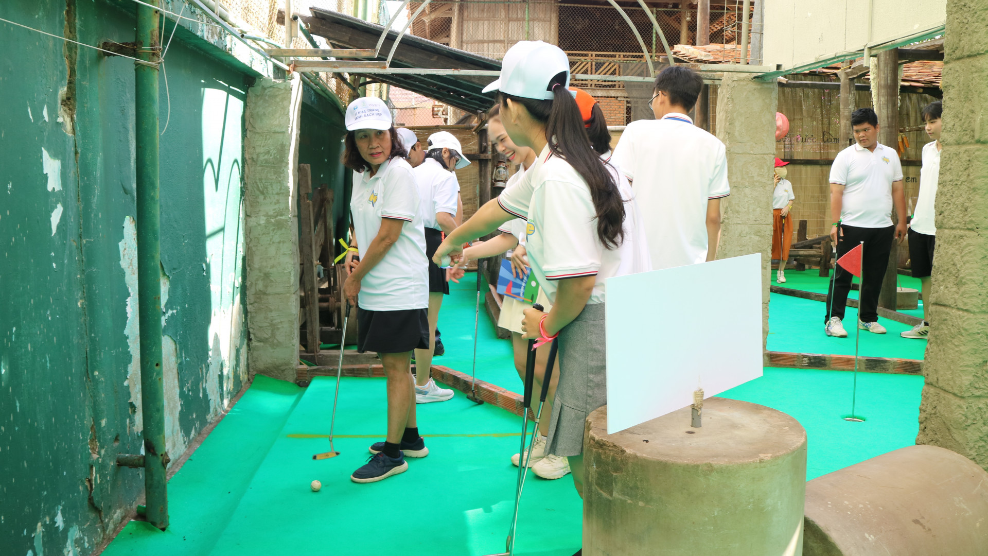 Adults of different ages join mini-golf tournament