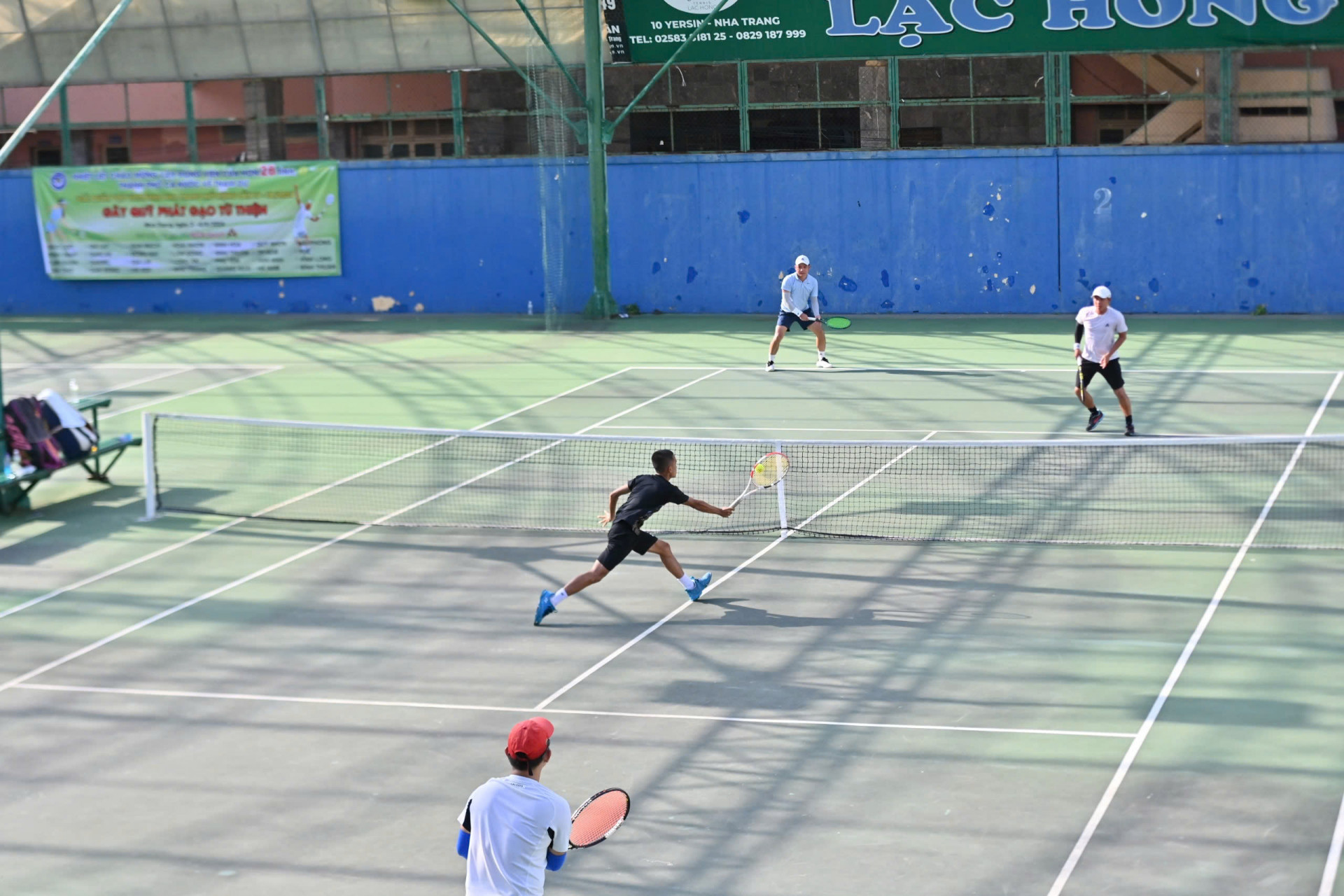 Players competing at the 4th Viettennis Nha Trang tennis open tournament 

