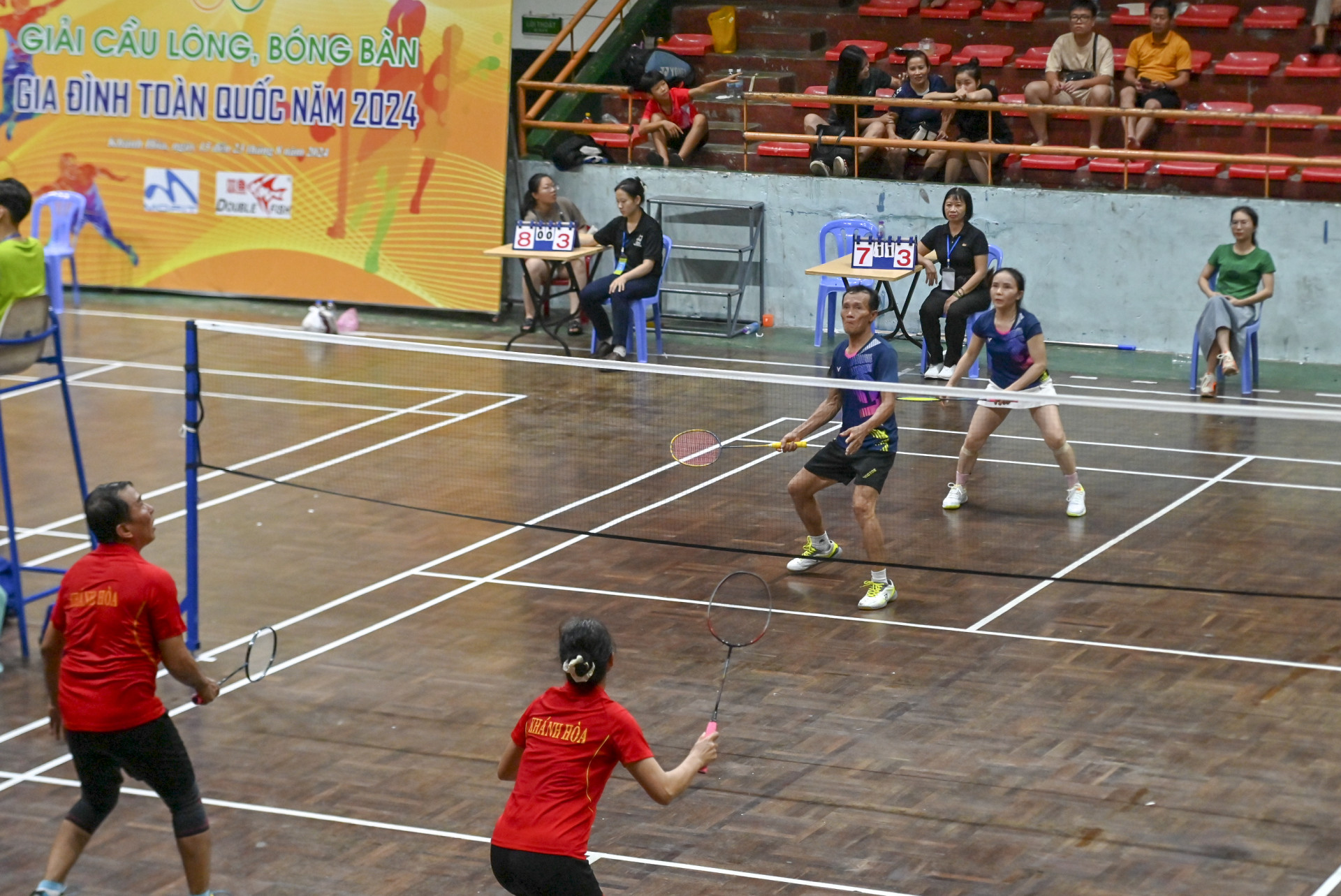 Trang’s parents (on the right side) competing in badminton husband and wife’s event

