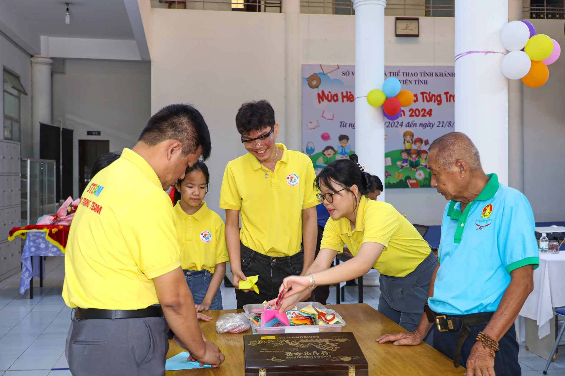 Steam Nha Trang members doing origami 

