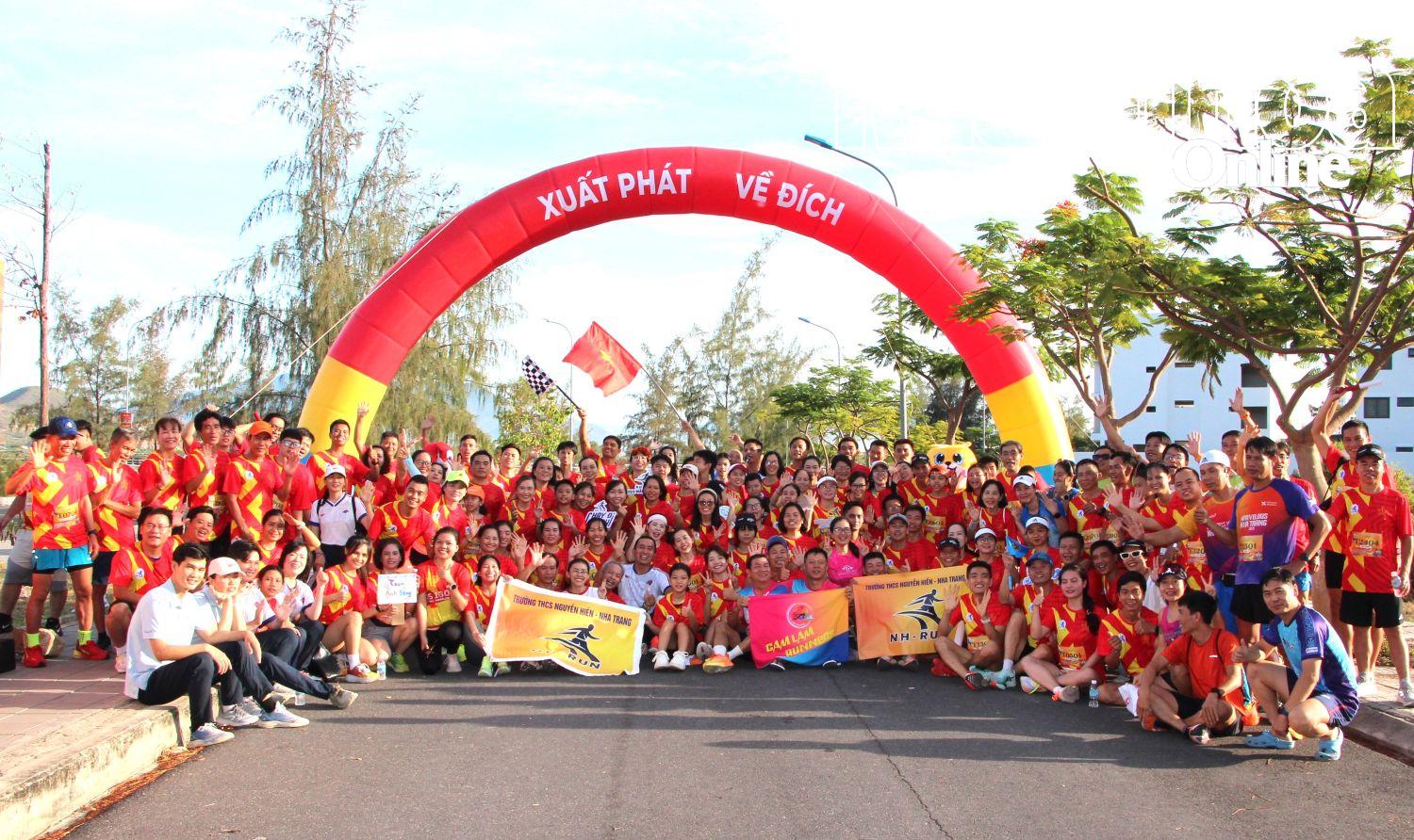 The runners posing for photos
