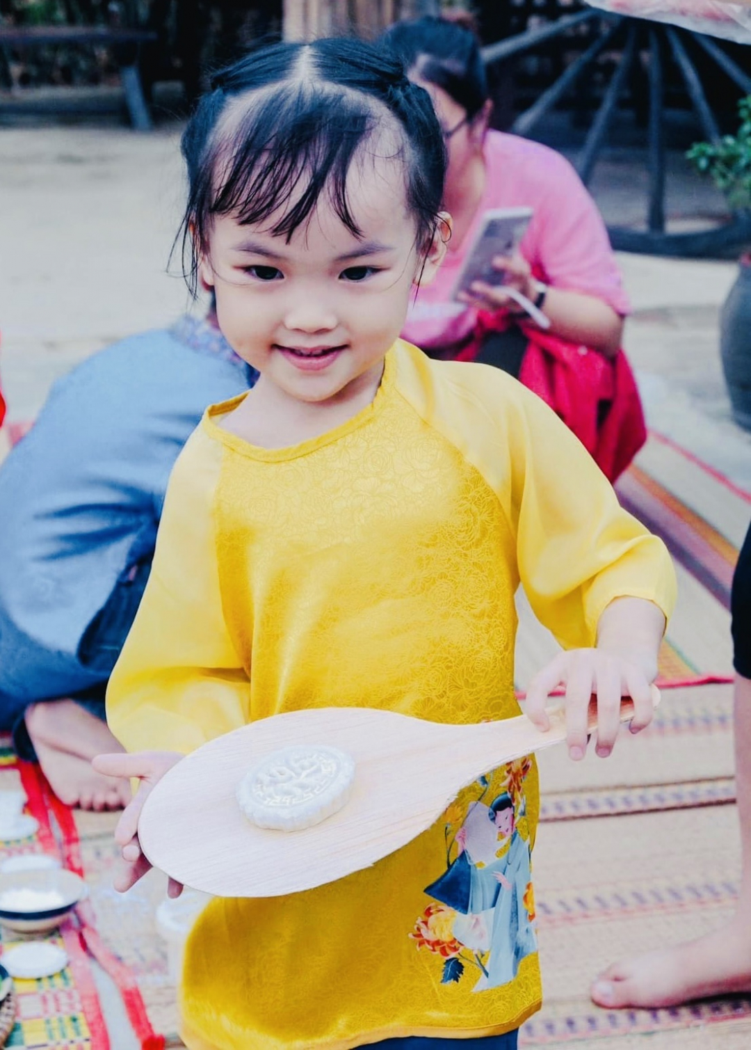 A little girl with a handmade mooncake
