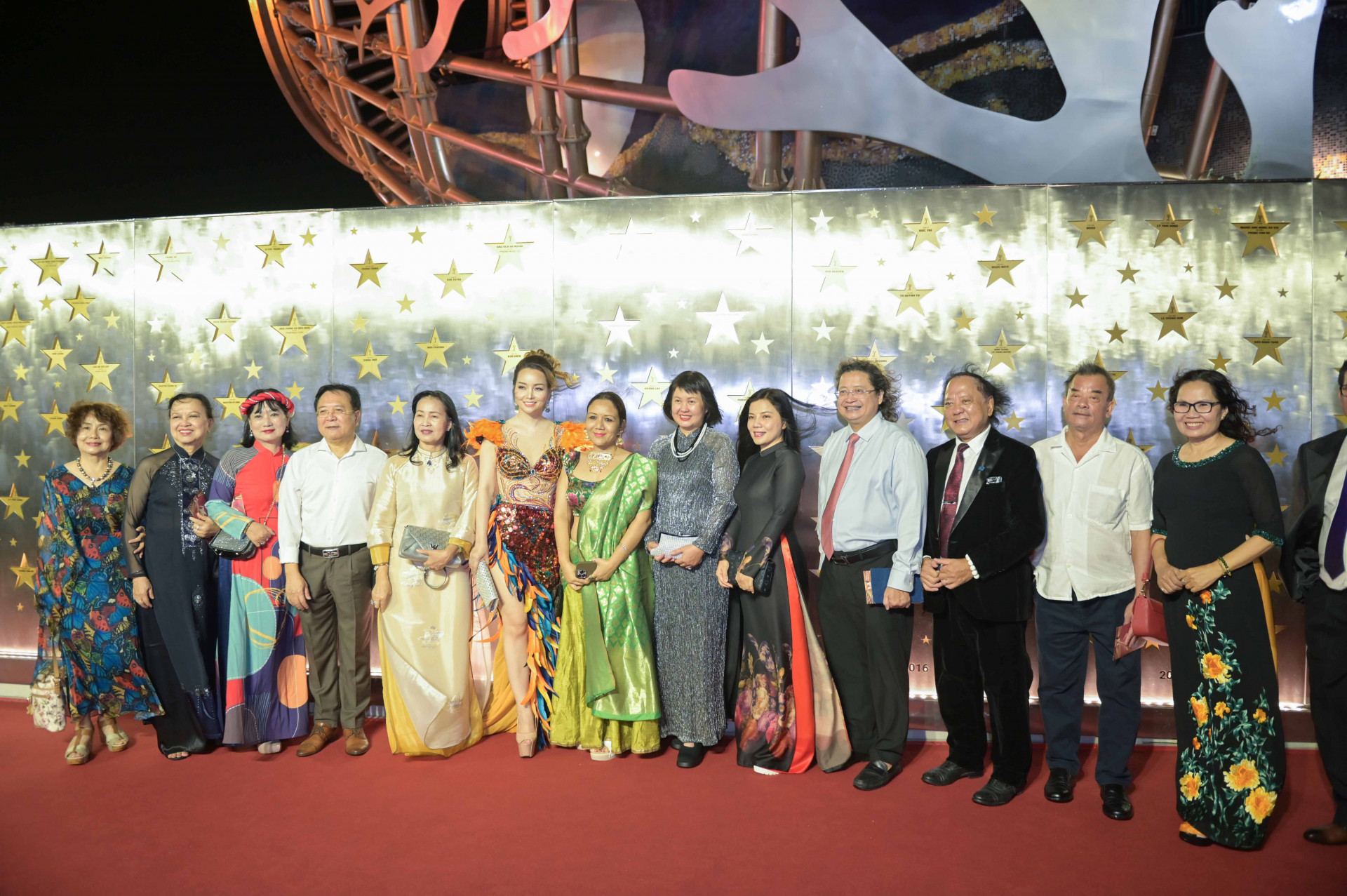 The representatives and artists posing for photo at the Wall of Fame

