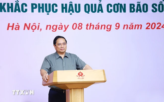 Thủ tướng Phạm Minh Chính chủ trì Hội nghị đánh giá thiệt hại và khắc phục hậu quả cơn bão số 3. (Ảnh: Dương Giang/TTXVN).