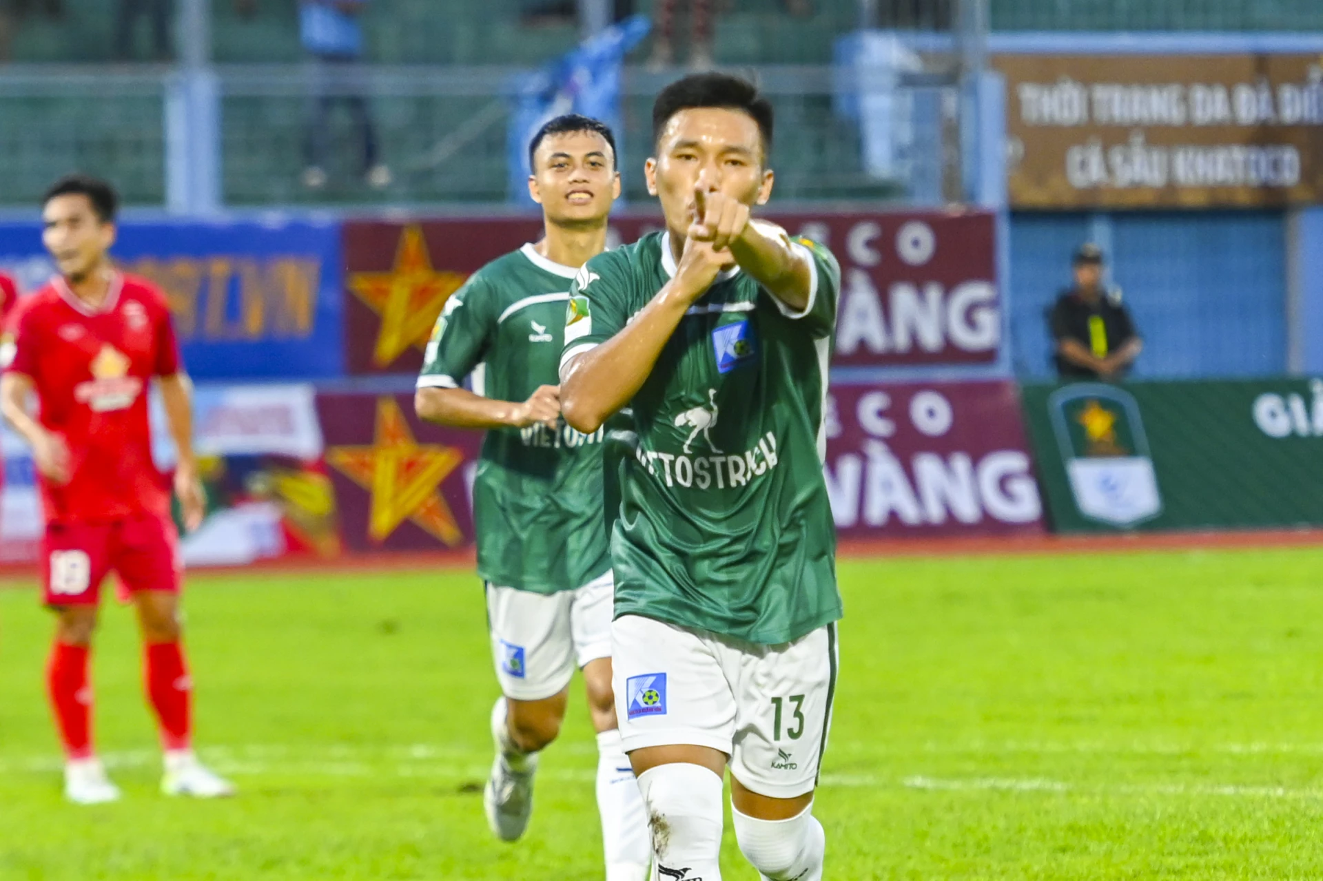 Khatoco Khanh Hoa players celebrate after scoring in the opening match against Long An

