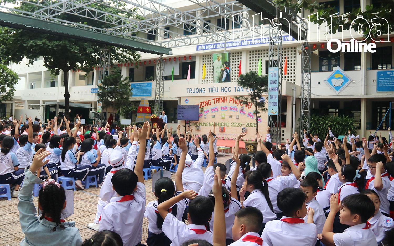 Pupils eagerly participating in question and answer game 

