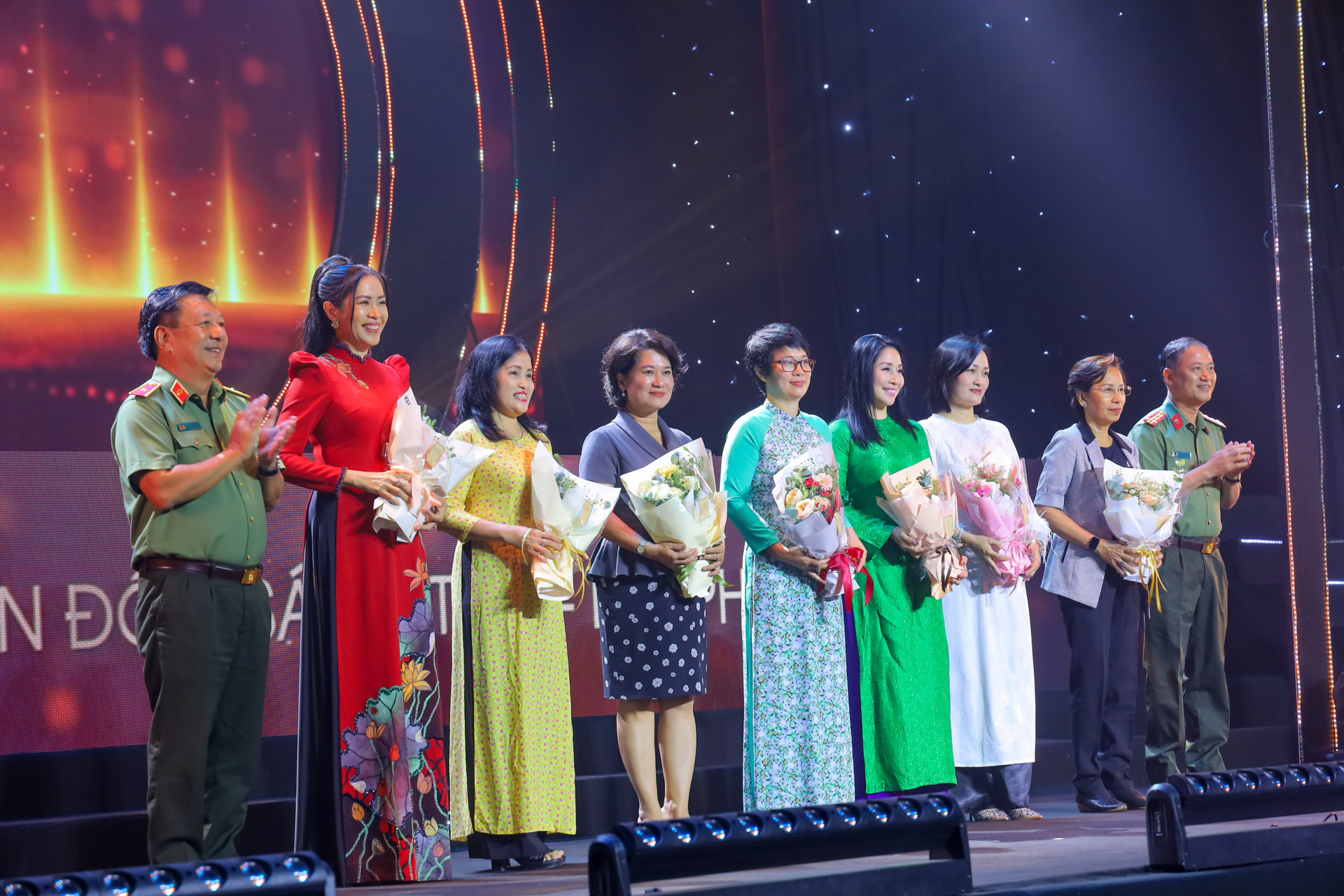 The representatives of the organizing committee giving flowers to the female judges on occasion of Vietnamese Womens Day

