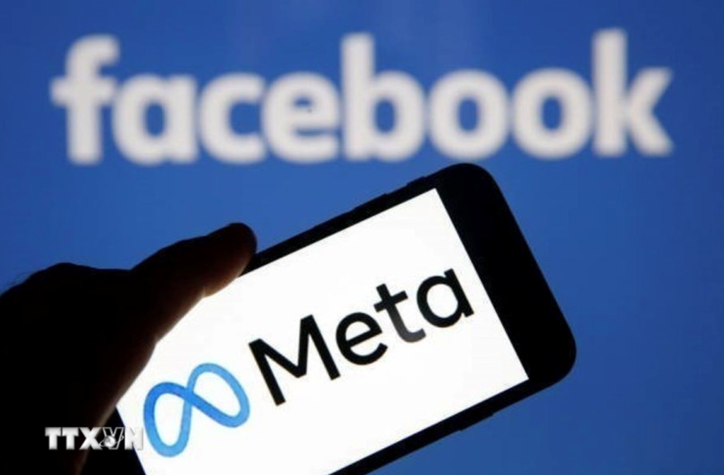 Biểu tượng Meta và Facebook trên màn hình điện thoại thông minh. Ảnh: Getty Images/TTXVN