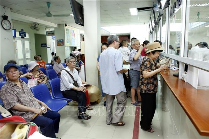 Bệnh nhân đến khám, chữa bệnh tại Bệnh viện Đa khoa Đống Đa (Hà Nội). Ảnh tư liệu: Dương Ngọc/TTXVN