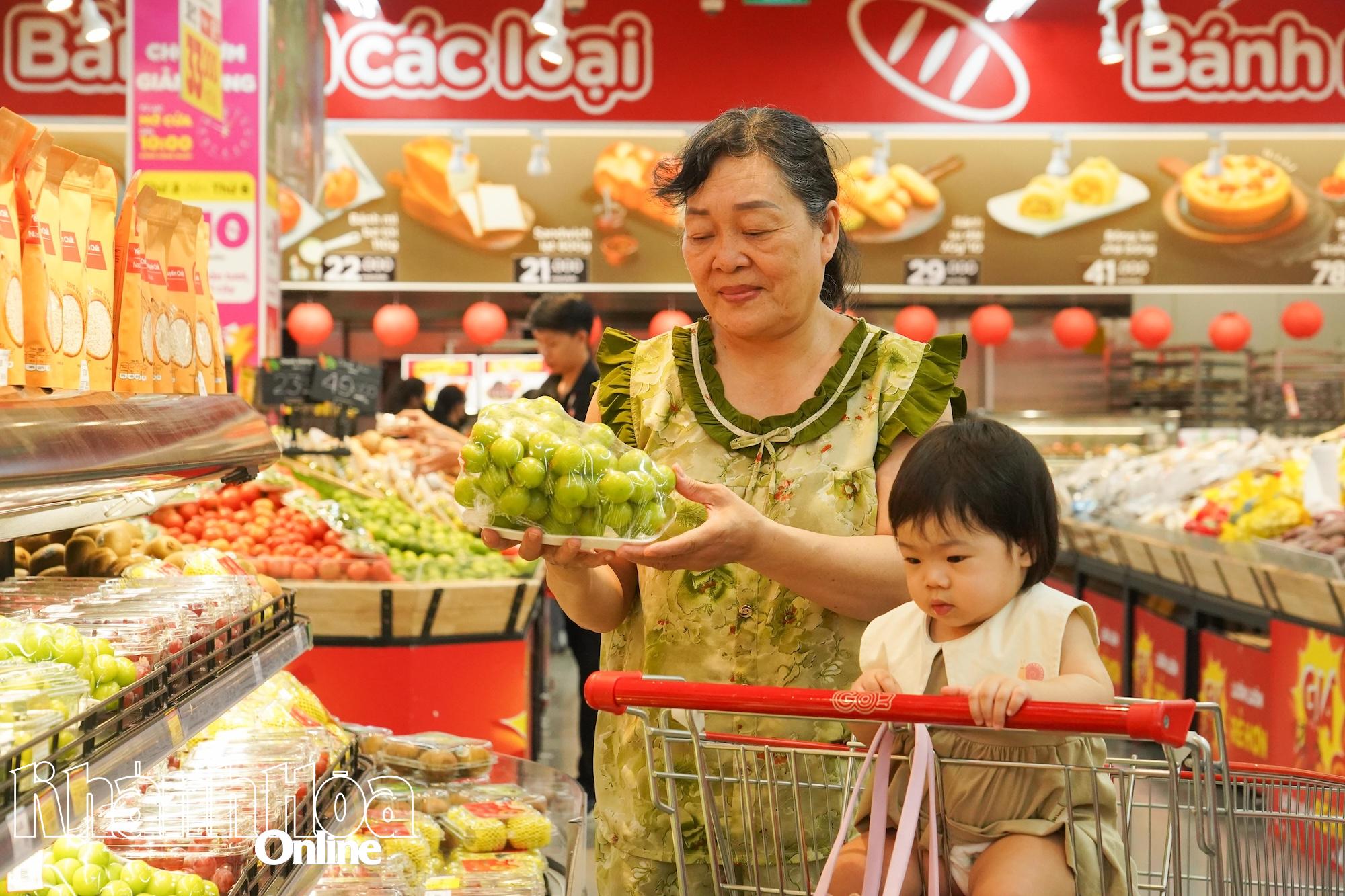 Customers buying fruits at GO! Phan Rang supermarket.