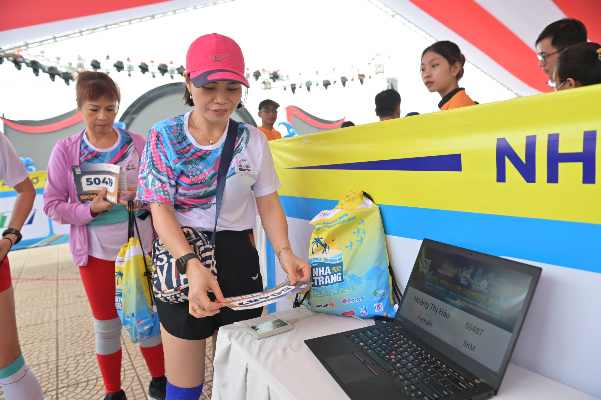 Runners checking their registration information

