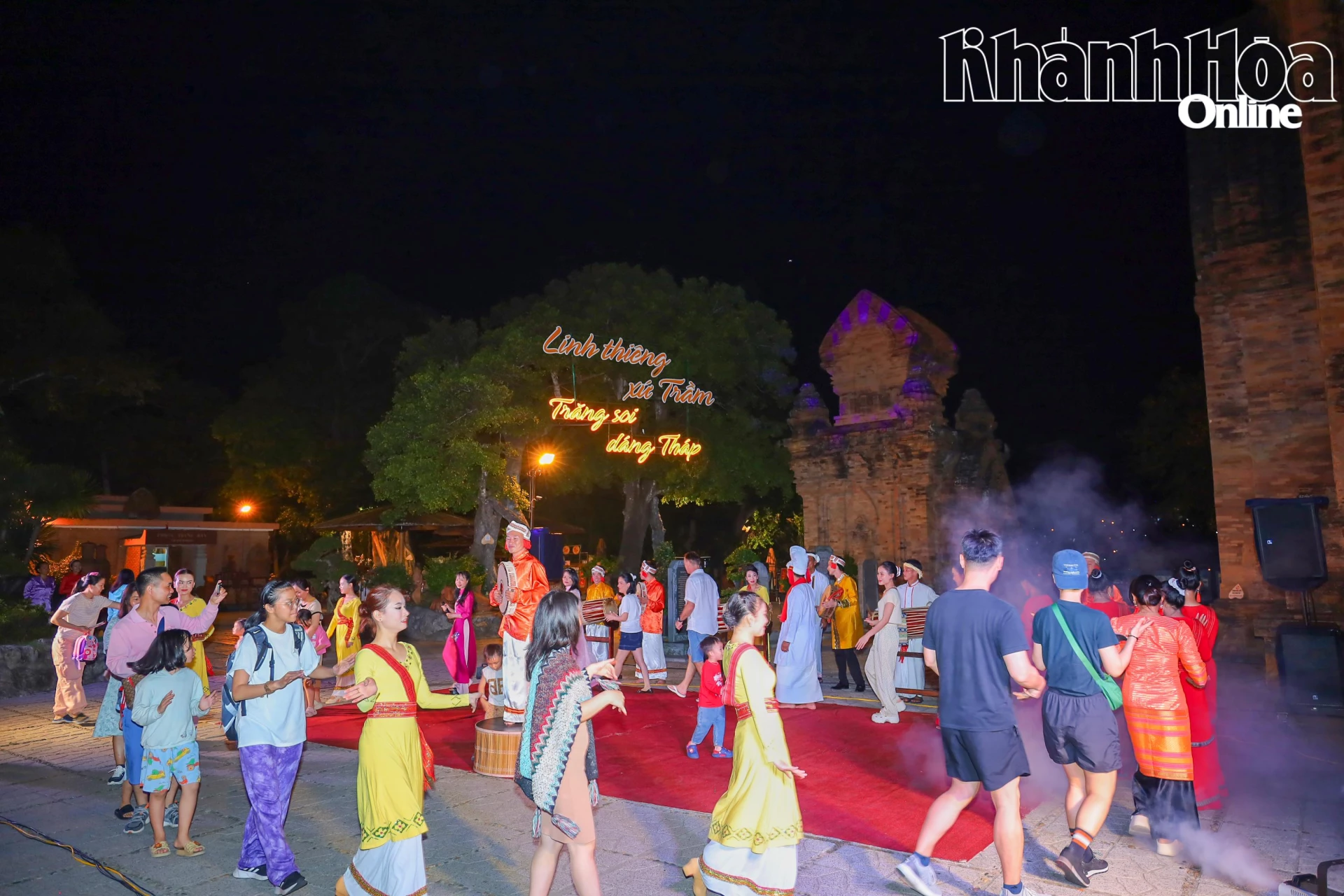 Tourists join a night arts program at Po Nagar Temple