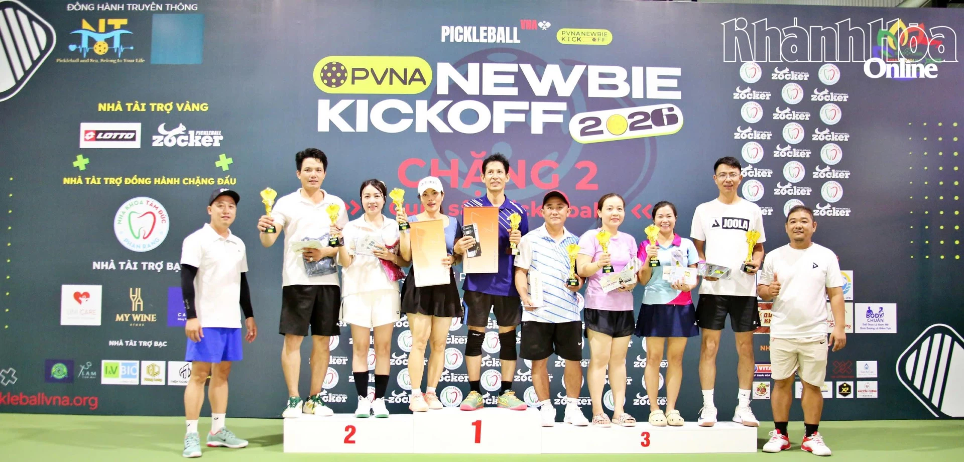Organizers giving prizes to winners of mixed doubles