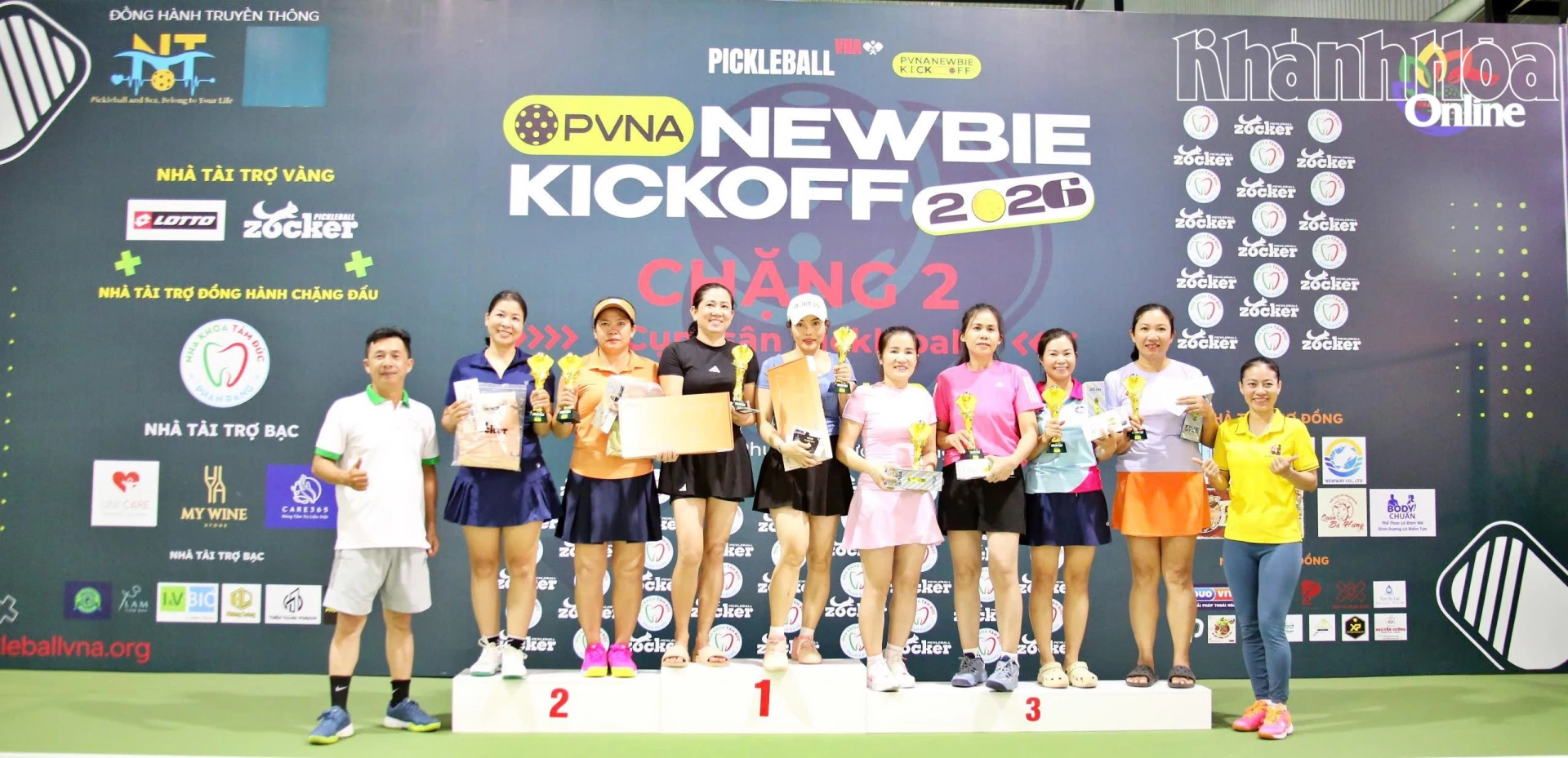 Organizers giving prizes to winners of women’s doubles
