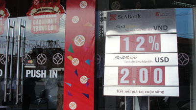 Trần lãi suất huy động giảm còn 12%/năm