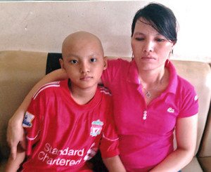 Visually impaired woman looks after her little son who has cancer
