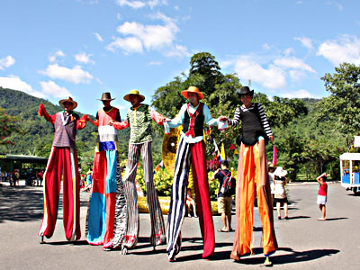 Stilt walkers welcoming visitors in Yang Bay Tourist Park