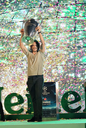 Carles Puyol introduces UEFA Champions League trophy to people in Nha Trang.