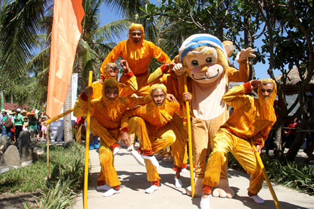 Staffs of Monkey Island tourist site dress as monkeys.