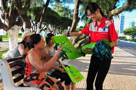 Giving bags to people in Nha Trang City.