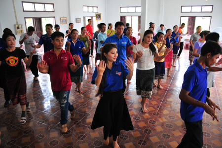 Members of two units practicing line dances and traditional dances of Vietnam and Laos.