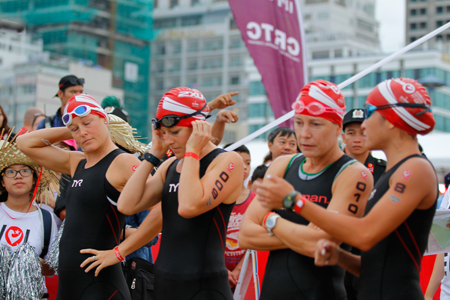 Athletes preparing for swimming event.