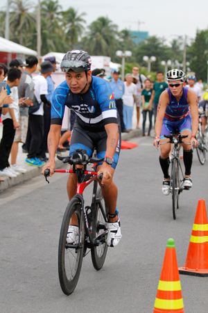 Competing in cycling event.