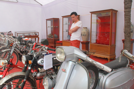 Vintage vehicles attract attention of visitors.