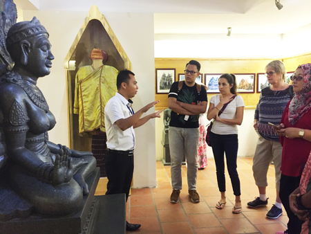 Tour guide introducing legend of Ponagar Goddess to delegates.