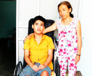 A young man with paraplegia needs help