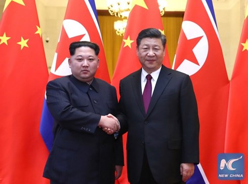 Điều ẩn chứa sau cái bắt tay lịch sử của Kim Jong-un và Tập Cận Bình