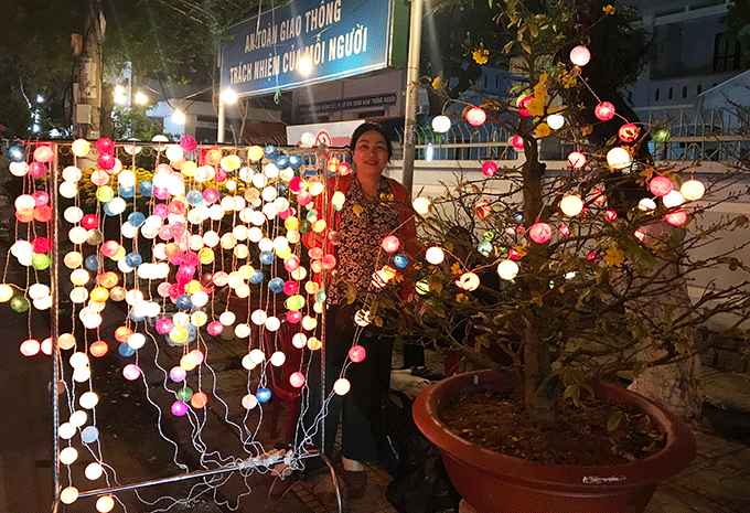 A person selling decorative lights on street