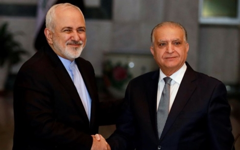 Ngoại trưởng Iran (trái) và người đồng cấp Iraq. Ảnh: Reuters.