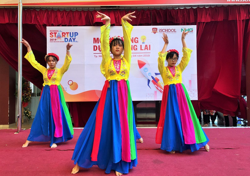 Students performing traditional dance at festival