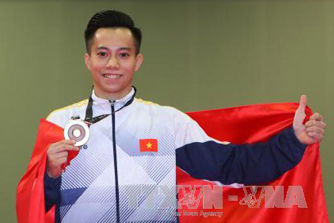 Thanh Tùng là VĐV thứ 2 của Việt Nam chính thức có vé dự Olympic 2020. Ảnh: TTXVN