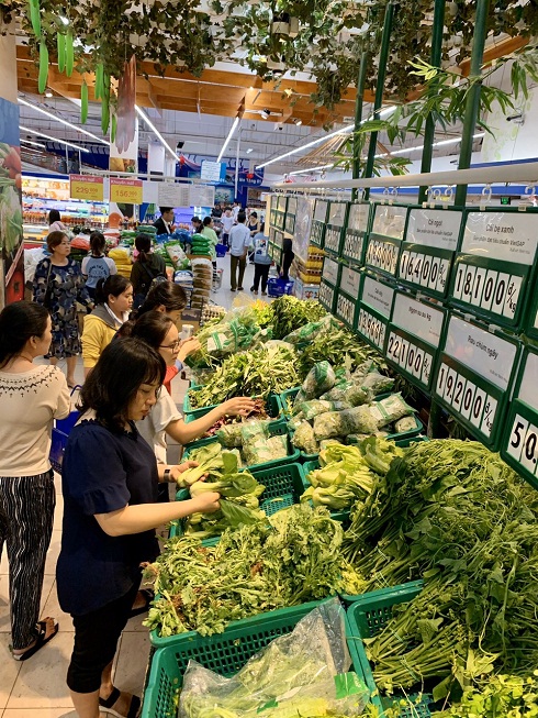 People buy vegetables at Co.opmart Supermarket