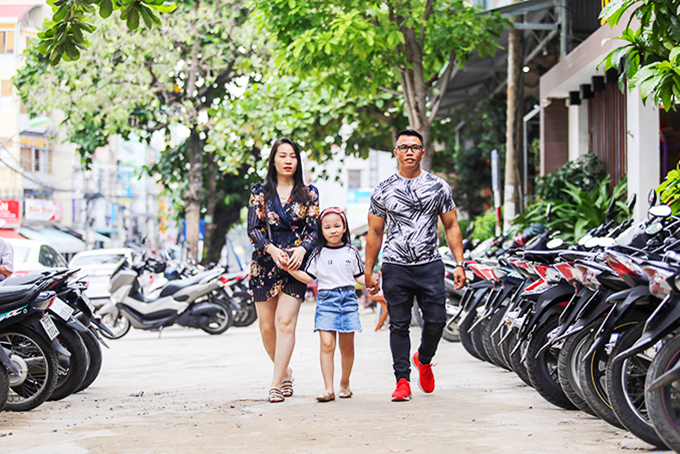Khanh Khuong and his family strolling street in Nha Trang