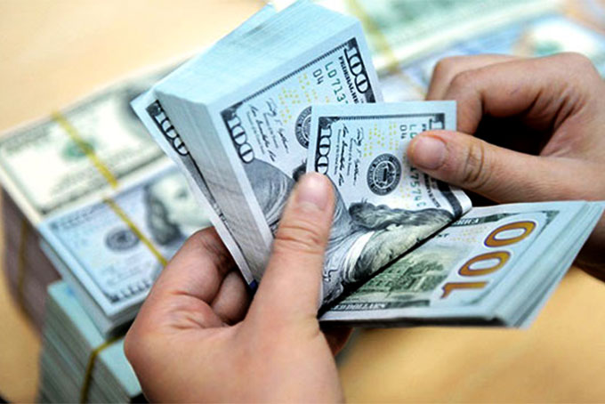 Tỷ giá trung tâm giảm, giá trao đổi USD cũng đồng loạt đi xuống