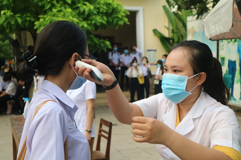 All students have body temperature checked before entering school