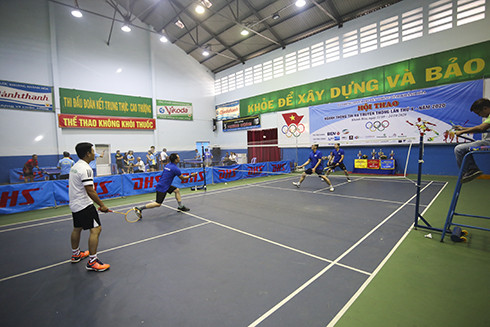 Players competing in badminton…
