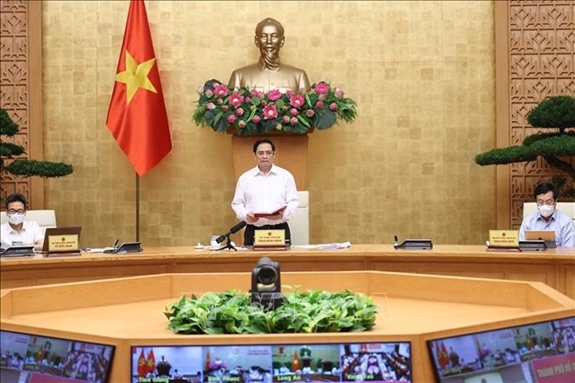  Thủ tướng Phạm Minh Chính chủ trì họp trực tuyến với 8 tỉnh, thành phía Nam về công tác phòng, chống dịch COVID-19. (Ảnh: TTXVN).