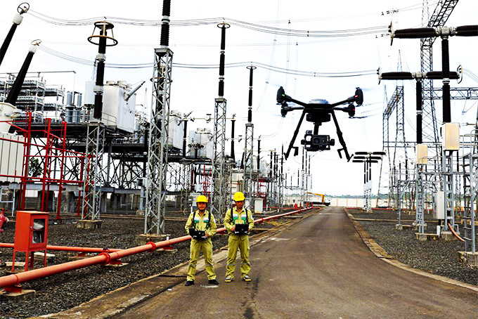 Technicians using drones to observe grid