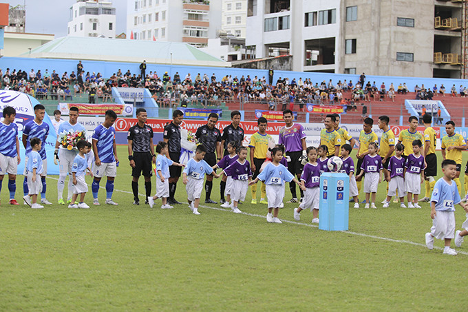 Two teams line up before the start of the match