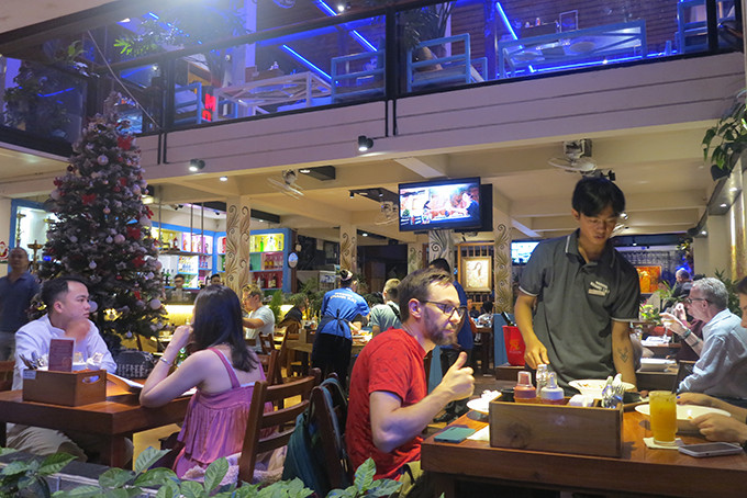 Tourists enjoy dinner on New Year’s Eve 