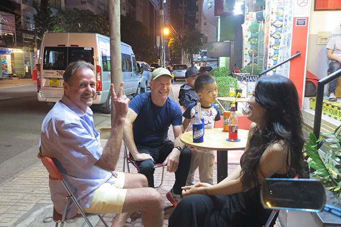 Tourists from the UK hanging out with friends on Nguyen Thien Thuat Street