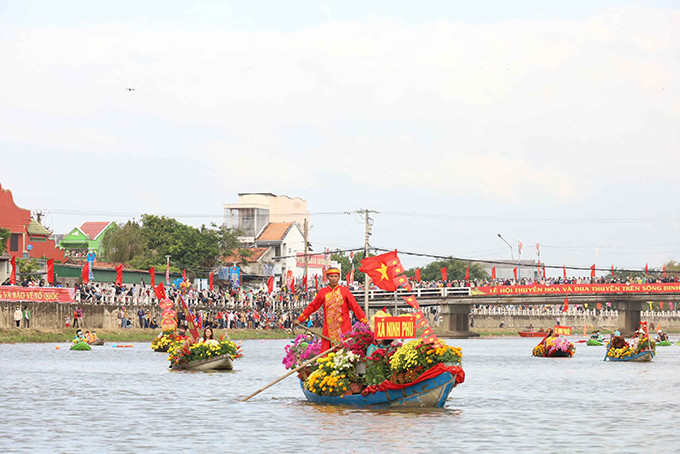 Flower boat festival and boat race on Dinh River in 2021